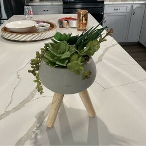 Chic Gray Planter with Wooden Legs and Lush Green Faux Succulents